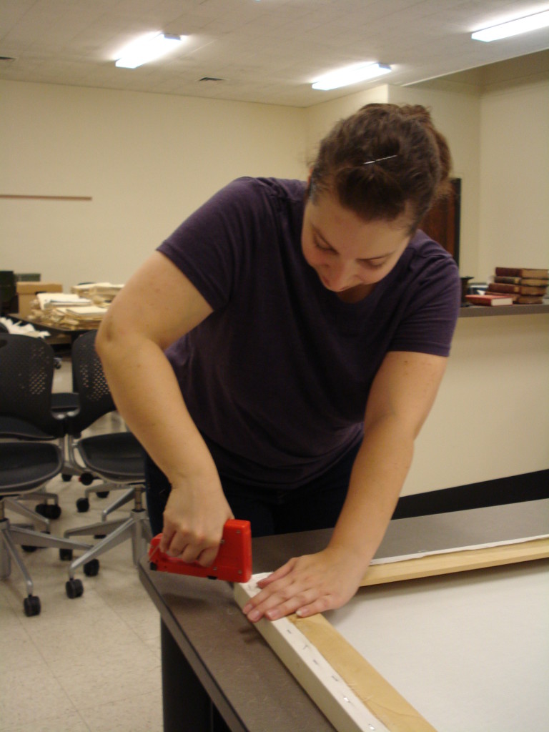 Putting the muslin lining back on the frame.  