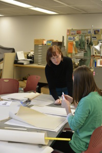 Holly explaining the advantages of a Teflon bonefolder to UCL communications coop student, Anna.