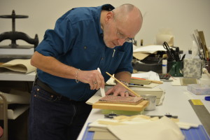 Senior conservation tech, Pat, working on one of the cradle arms.              