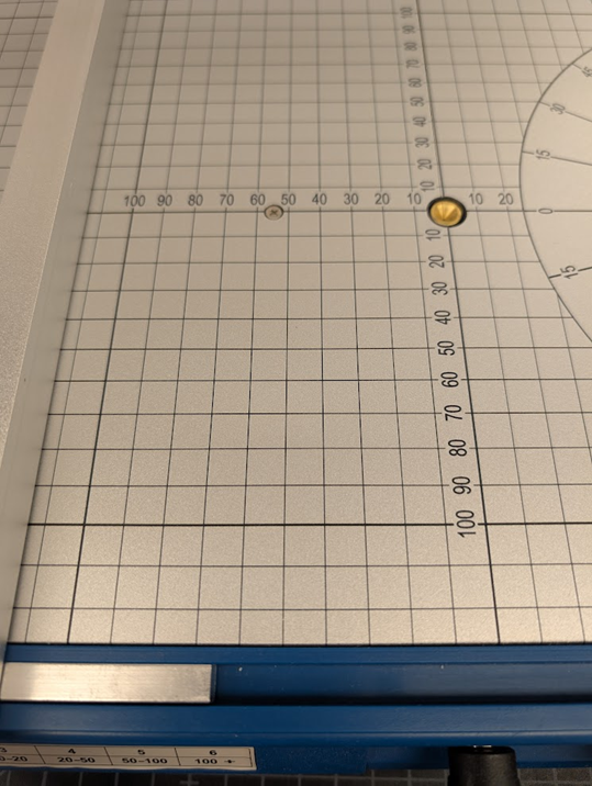 Image of the measurement grid in millimeters on the base of the Hercules foam cutter.