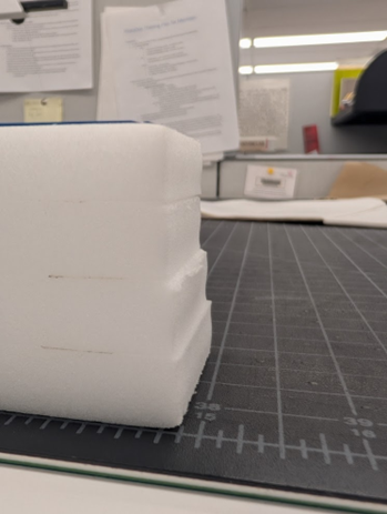Stack of foam sheets with emphasis on their imperfect cut edges.